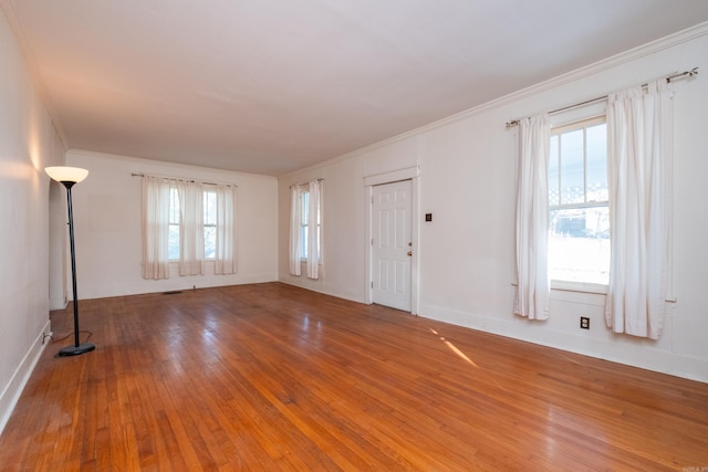 interior space featuring hardwood / wood-style floors and ornamental molding