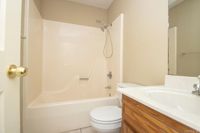 full bathroom featuring tile patterned floors, bathtub / shower combination, vanity, a textured ceiling, and toilet