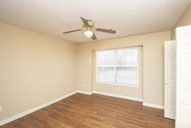 spare room featuring a textured ceiling, dark hardwood / wood-style floors, and ceiling fan