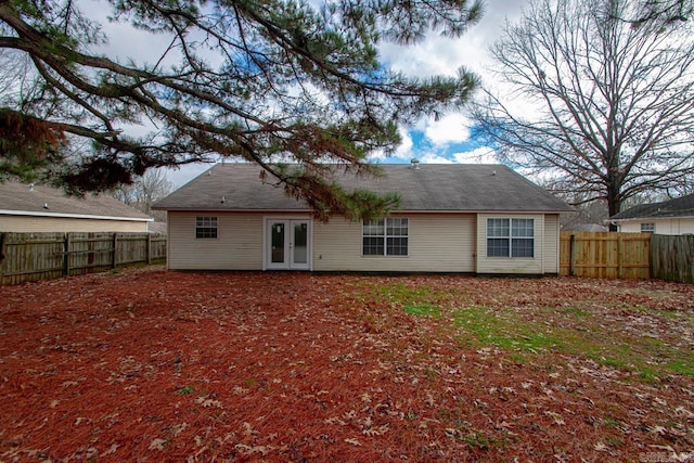 rear view of house featuring french doors