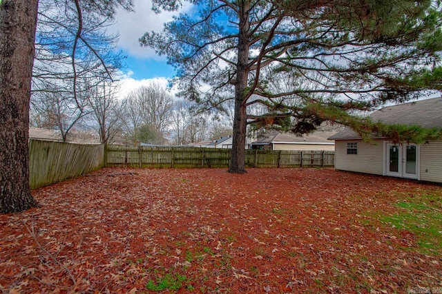 view of yard with french doors