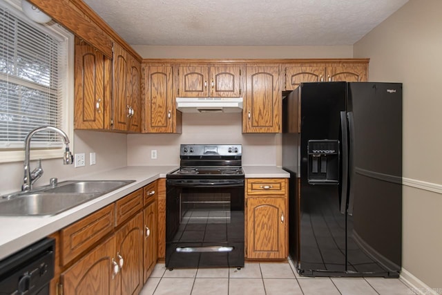 kitchen with sink, a textured ceiling, light tile patterned flooring, and black appliances