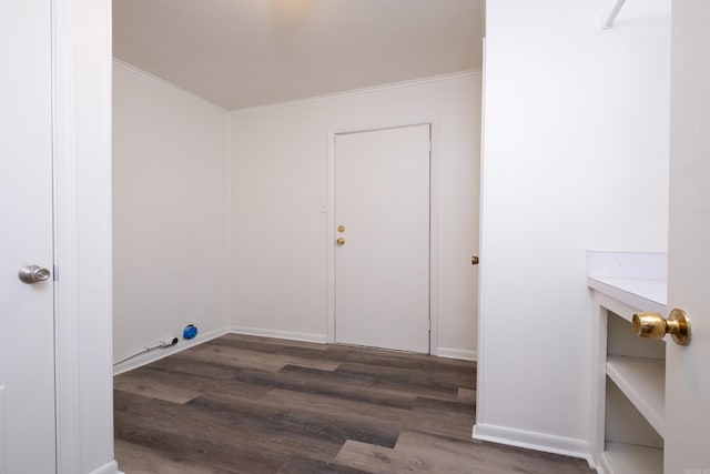 washroom featuring dark wood-type flooring and ornamental molding