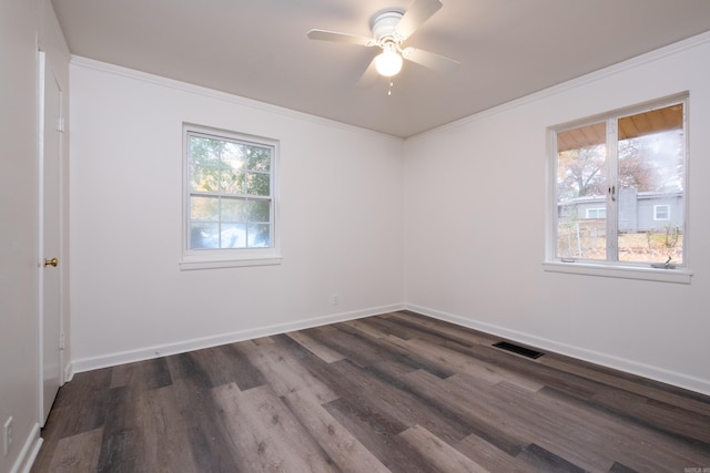 spare room with ceiling fan, dark hardwood / wood-style flooring, and ornamental molding