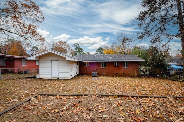 back of property with central AC unit