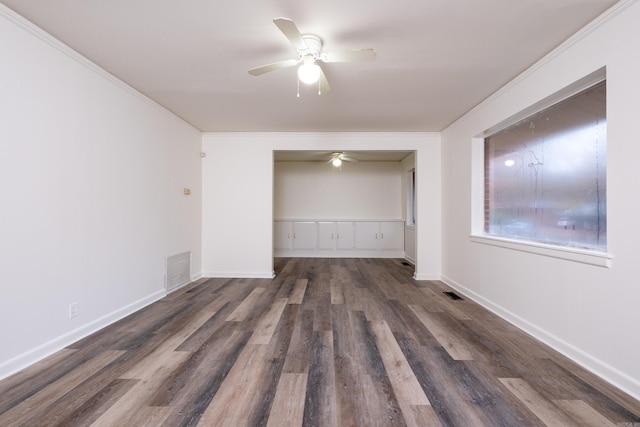 unfurnished bedroom featuring crown molding, a closet, dark wood-type flooring, and ceiling fan