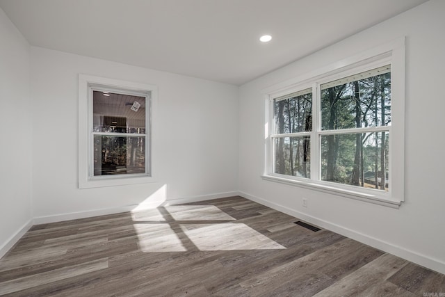 unfurnished room featuring hardwood / wood-style floors