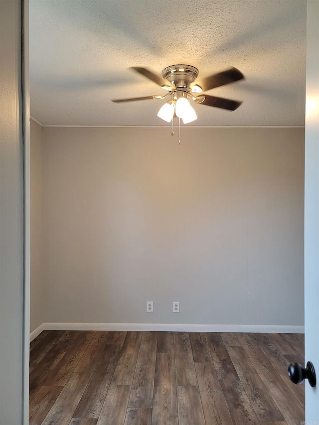 unfurnished room featuring dark hardwood / wood-style floors, ceiling fan, and a textured ceiling