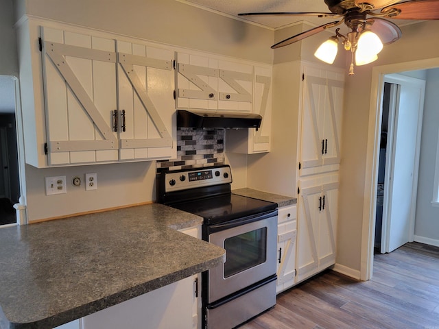 kitchen with dark hardwood / wood-style flooring, backsplash, ceiling fan, electric stove, and white cabinets