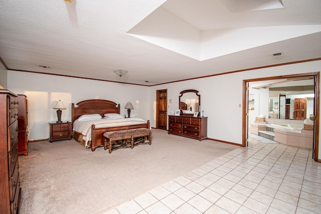 bedroom featuring crown molding, light carpet, and connected bathroom