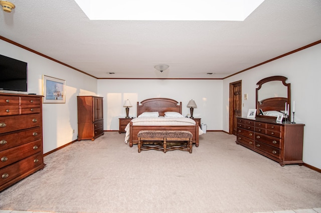 bedroom with a skylight, light carpet, and crown molding