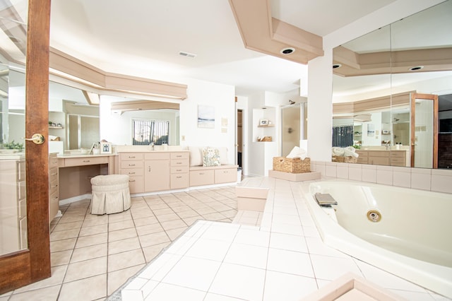 bathroom featuring shower with separate bathtub, vanity, and tile patterned floors