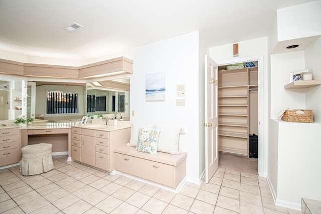 bathroom with tile patterned flooring and vanity