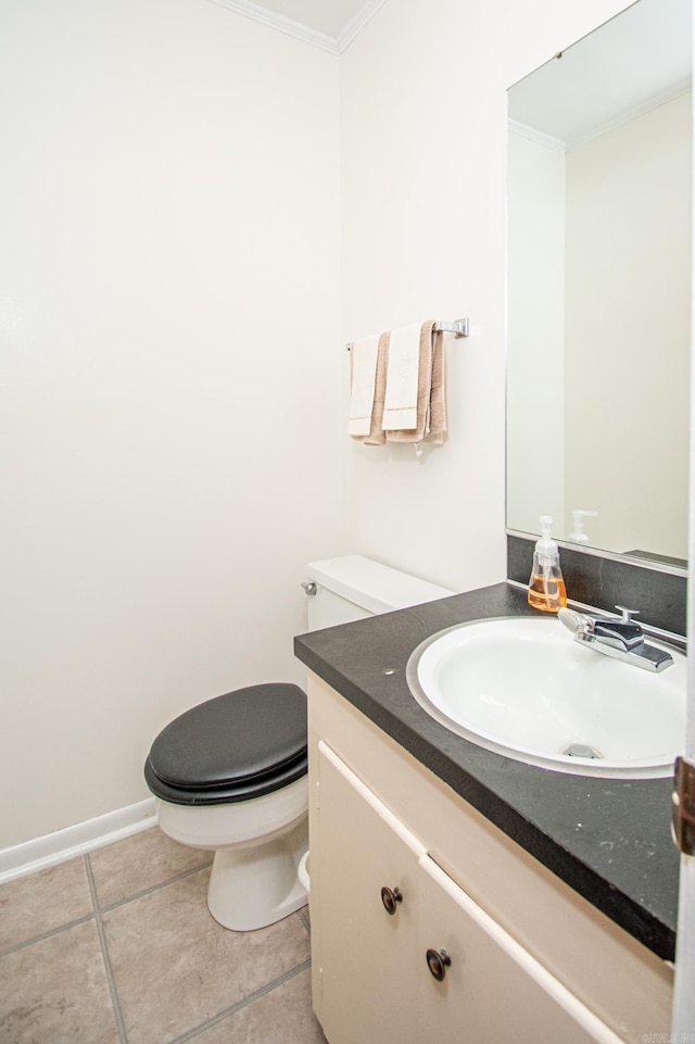 bathroom with crown molding, tile patterned flooring, vanity, and toilet