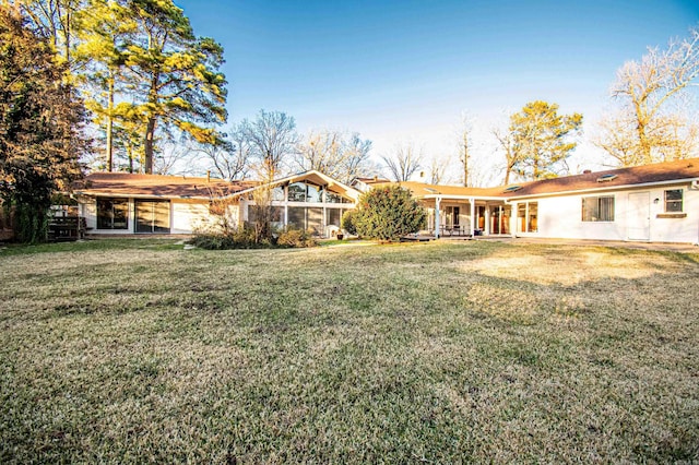 back of house with a yard