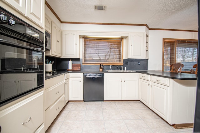 kitchen featuring white cabinets, sink, and black appliances