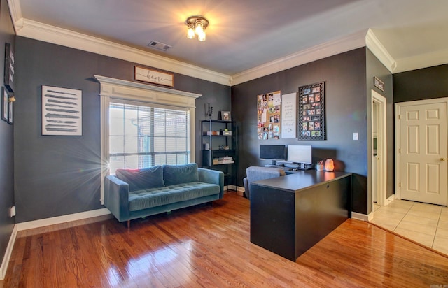 home office featuring hardwood / wood-style flooring and crown molding