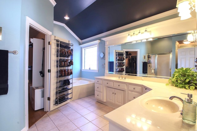 bathroom featuring tile patterned floors, separate shower and tub, vaulted ceiling, vanity, and ornamental molding