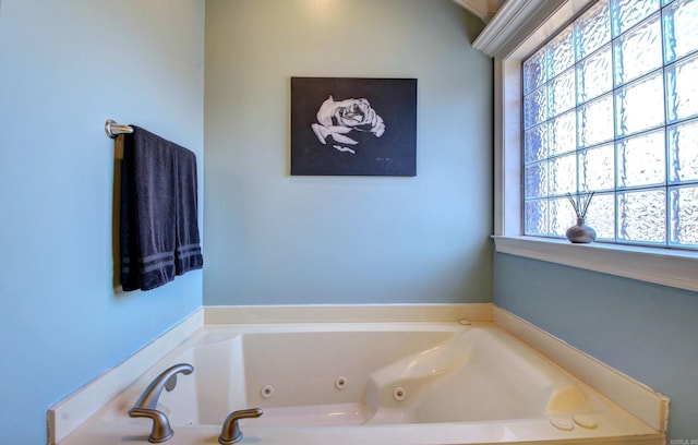 bathroom with a tub to relax in