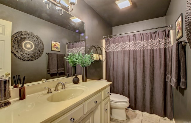 bathroom featuring tile patterned flooring, vanity, a shower with shower curtain, and toilet