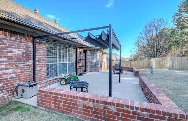 view of patio / terrace with a fire pit