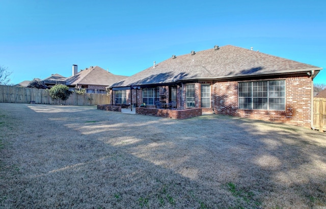 rear view of property with a patio area