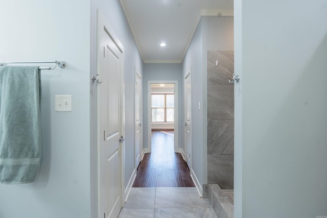 bathroom featuring tile patterned flooring, a shower, and ornamental molding