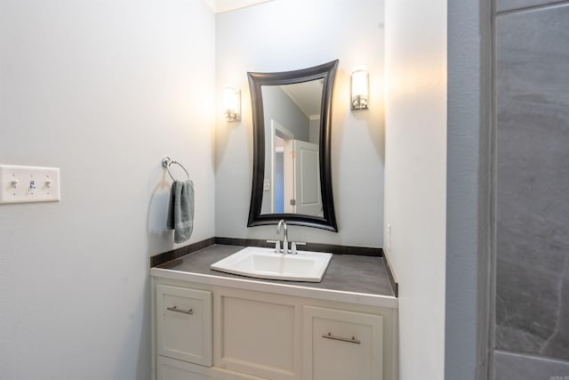 bathroom with vanity and ornamental molding