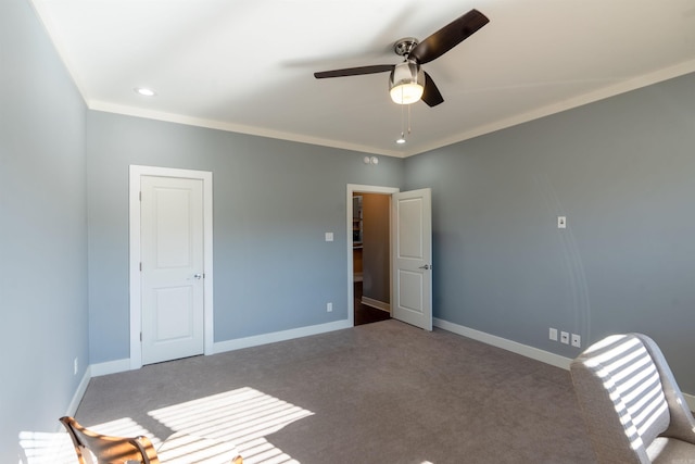 unfurnished bedroom with ceiling fan, carpet, and ornamental molding