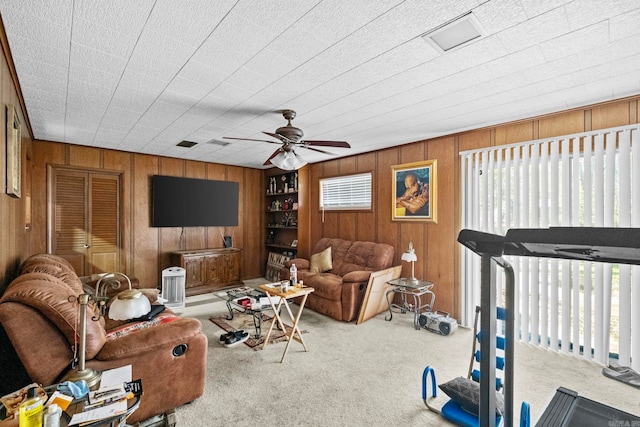 living room featuring ceiling fan and light colored carpet