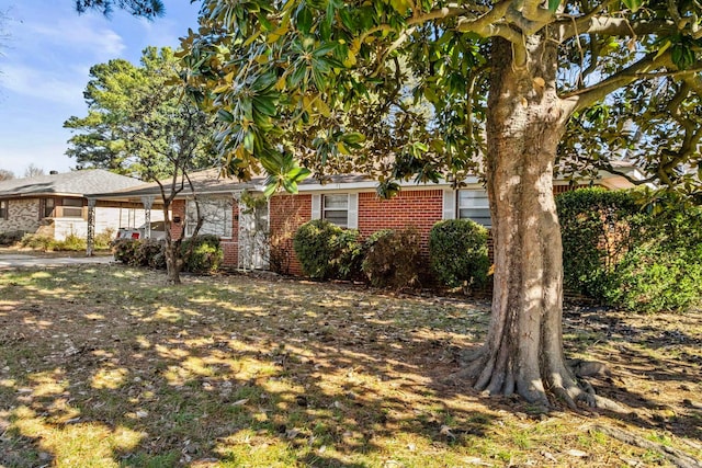 obstructed view of property featuring a carport