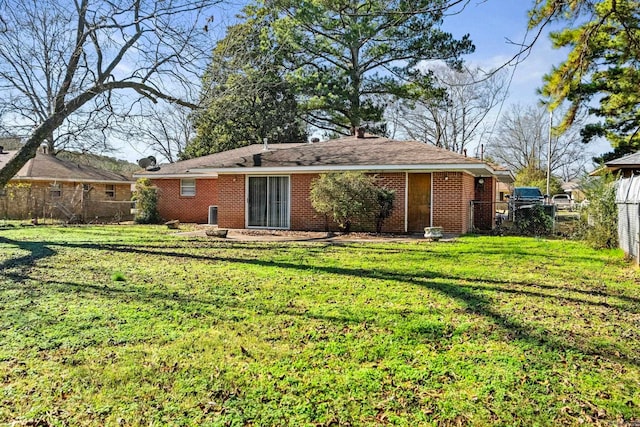 back of house with a yard