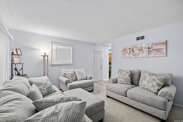 living room with carpet and crown molding