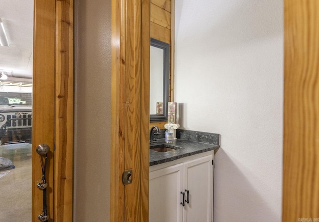 bathroom with a textured ceiling and vanity