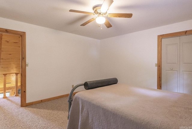 bedroom featuring a closet, ceiling fan, and light colored carpet