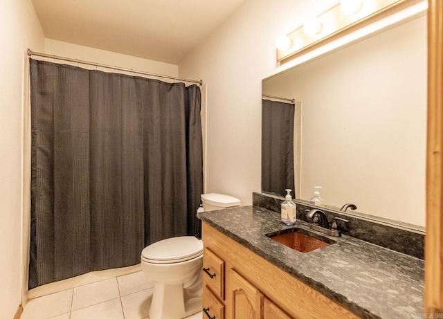 bathroom with tile patterned floors, vanity, and toilet