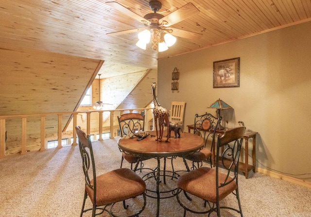 dining space with ceiling fan, crown molding, wood ceiling, and light carpet