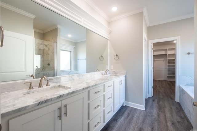 bathroom featuring crown molding, vanity, independent shower and bath, and wood-type flooring