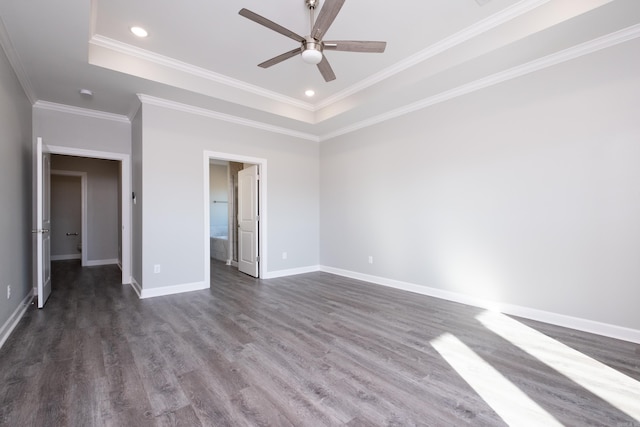 unfurnished bedroom featuring ceiling fan, a raised ceiling, and ornamental molding