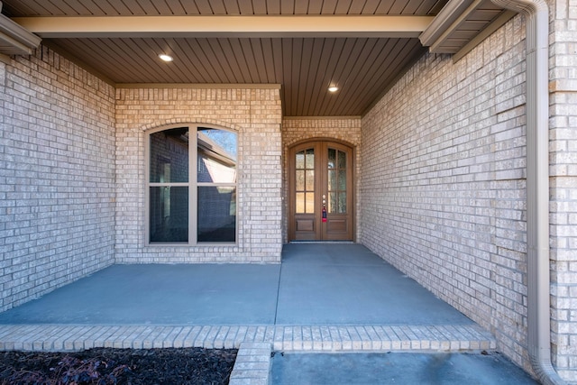 doorway to property with a patio area and french doors