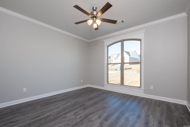 empty room with ceiling fan, crown molding, and dark wood-type flooring