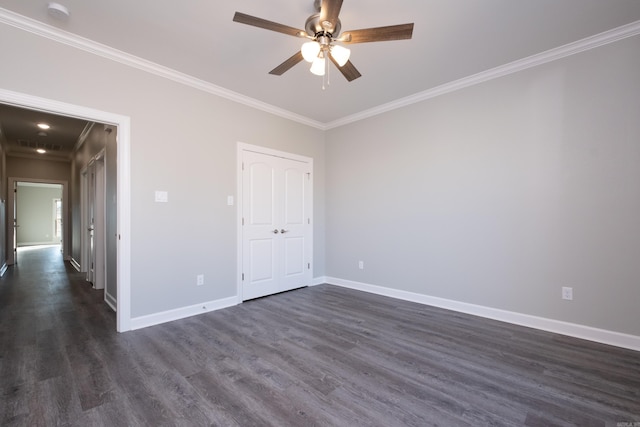 spare room with crown molding, ceiling fan, and dark hardwood / wood-style floors