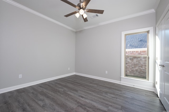 empty room featuring dark hardwood / wood-style floors, ceiling fan, and ornamental molding