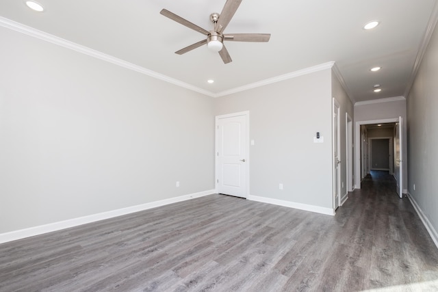 spare room with ceiling fan, crown molding, and dark wood-type flooring