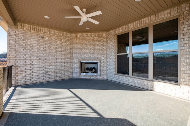 view of patio featuring ceiling fan