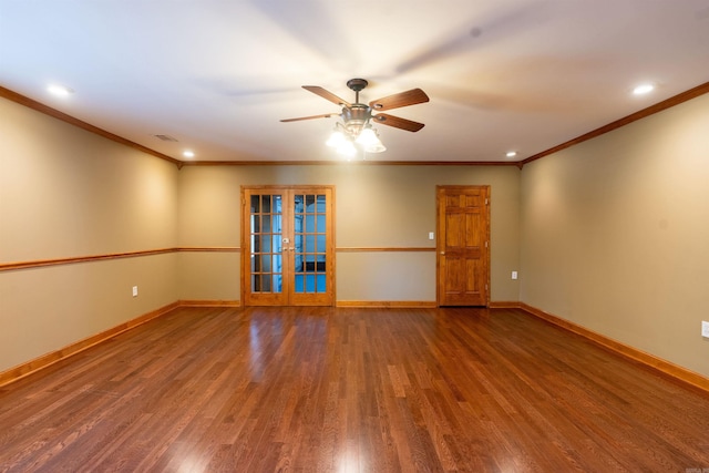 empty room with french doors, ceiling fan, ornamental molding, and hardwood / wood-style floors