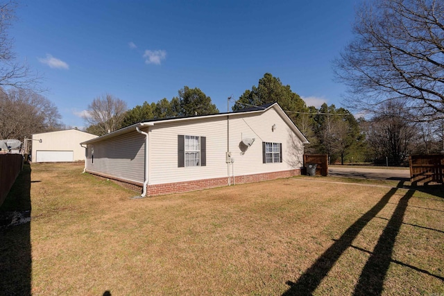 exterior space with a yard and a garage