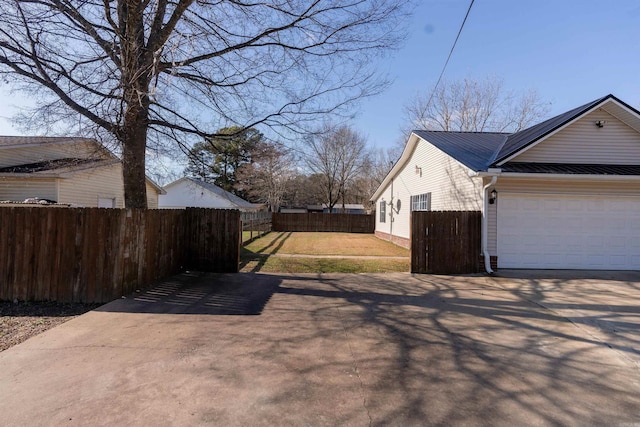 view of property exterior with a garage