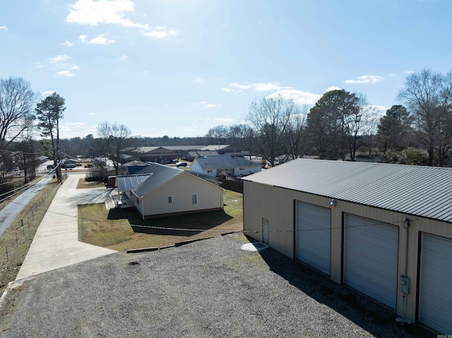 exterior space featuring a garage and an outdoor structure