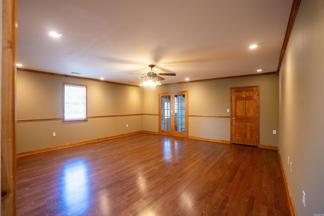 spare room with dark hardwood / wood-style flooring, crown molding, french doors, and ceiling fan